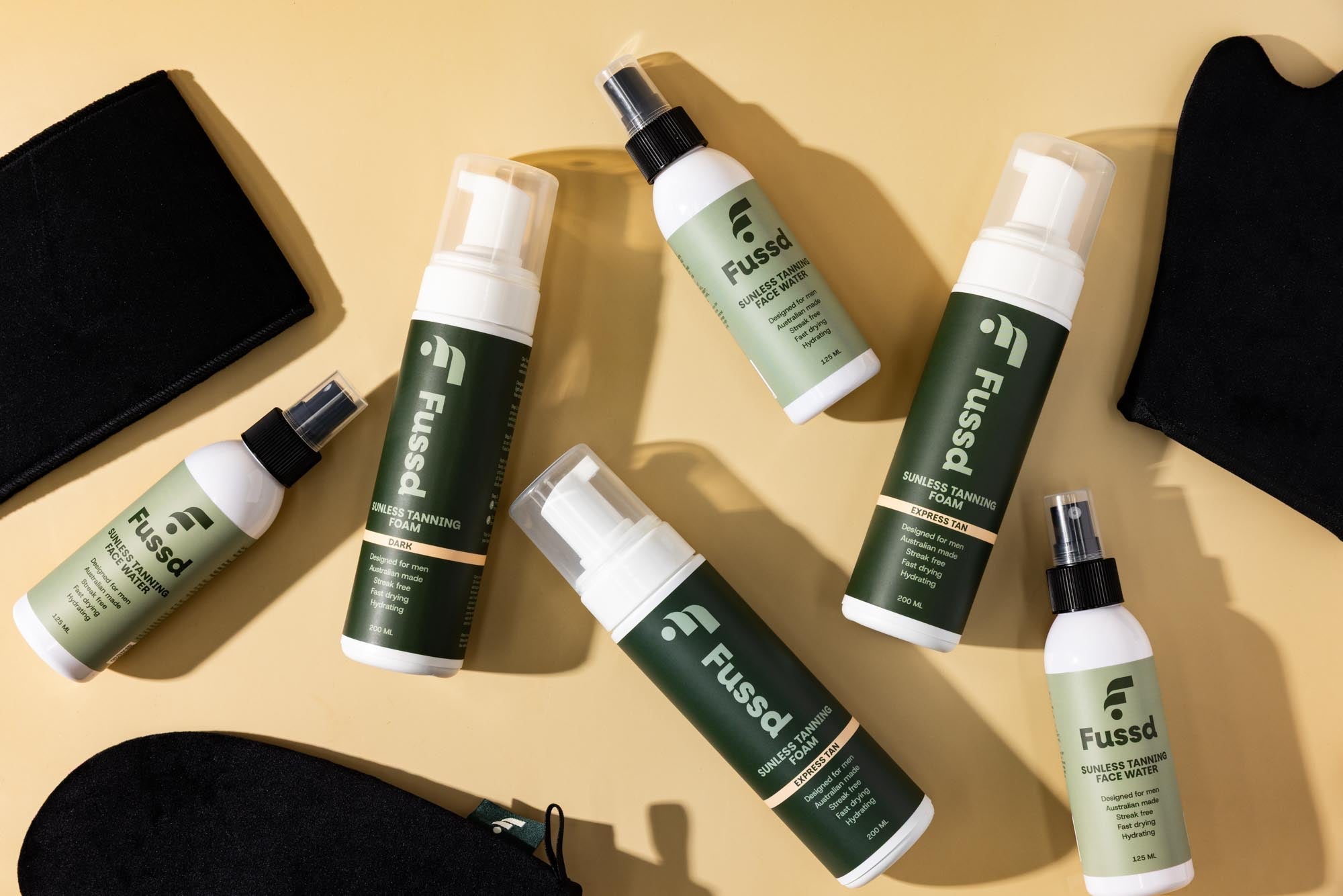 man applying fake tan